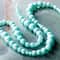 Perles rondes en verre nacré turquoise mat de Bead Landing